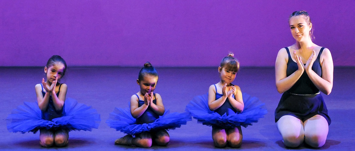 Young dancers perform on stage